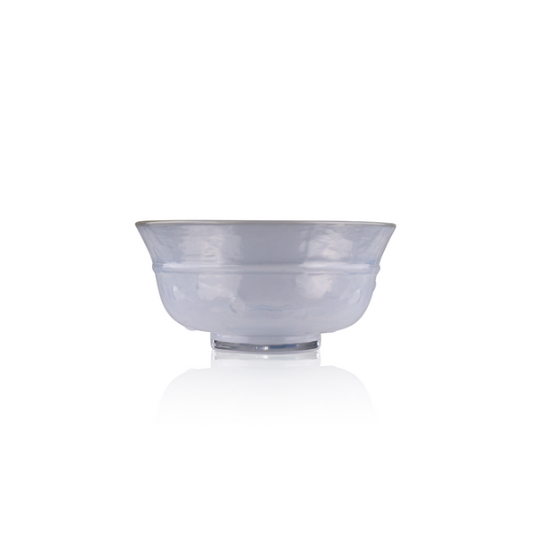 A broad, shallow glass bowl with a subtle blue tint rests on a solid base. Its wide rim gently curves outward, and the soft translucence allows light to highlight the textural details. The bowl is presented on a seamless white backdrop, creating a serene and delicate visual.