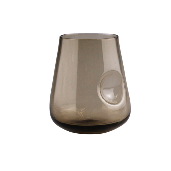 A stemless, smoky brown glass wine tumbler with a contemporary thumb indent, presenting a smooth, rounded base that gently tapers towards the rim, all set against a neutral backdrop.