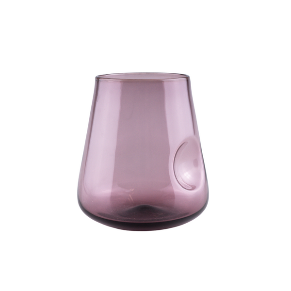 This is a soft mauve-colored stemless wine glass with a contemporary thumb indent, featuring a gradual transition from a dark base to a lighter top, all displayed on a neutral background that accentuates the glass's modern charm and subtle color palette.