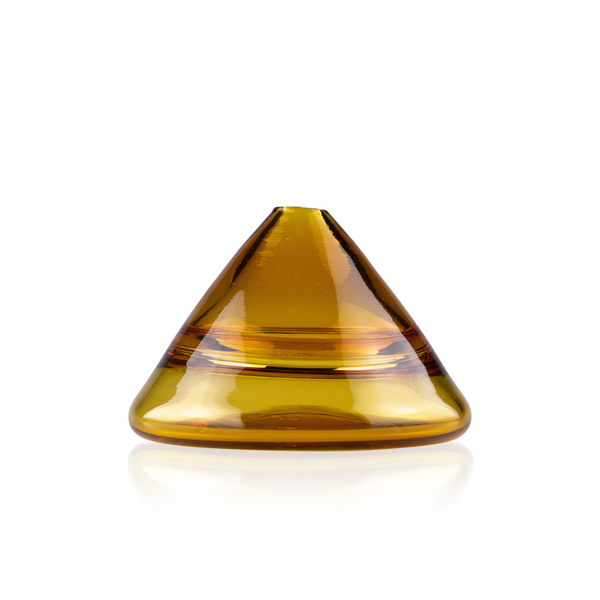 amber-colored conical glass vase with a glossy finish. Its wide base narrows to a pointed top, and its smooth, clear glass casts soft reflections, giving the vase an inviting, warm look. The vase's design is simple yet sophisticated, suitable for a modern aesthetic that favors bold simplicity.