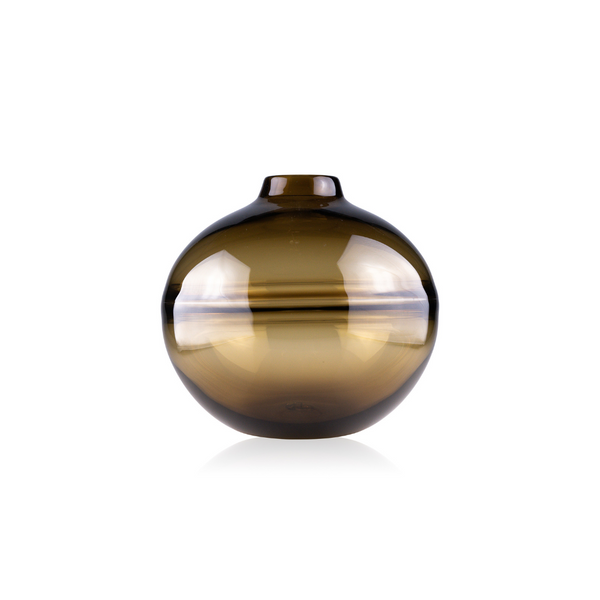 An amber-hued, spherical glass vase with a reflective surface and a subtle opening at the top, showcased against a pure white background. The vase's smooth, round shape is bisected by a clear, glossy band that captures the light, creating an eye-catching horizontal reflection.