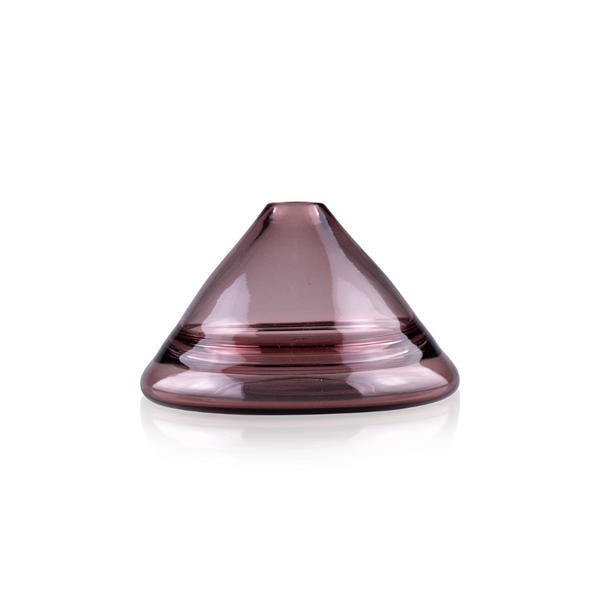 A sleek, cone-shaped glass vase in a muted pink hue with smooth contours and a flat base, exhibiting a soft, reflective surface. Two clear, horizontal bands add a subtle decorative element to the vase's design, set against a stark white background for contrast