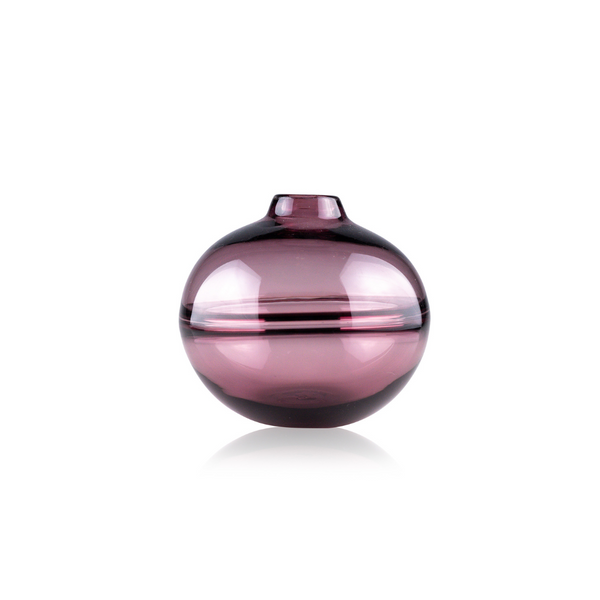 A translucent pink glass vase with a spherical body and a flat base, accented by a clear horizontal band and topped with a small neck. The elegant simplicity of the design is showcased against a pure white background, emphasizing the vase's delicate color and graceful contours
