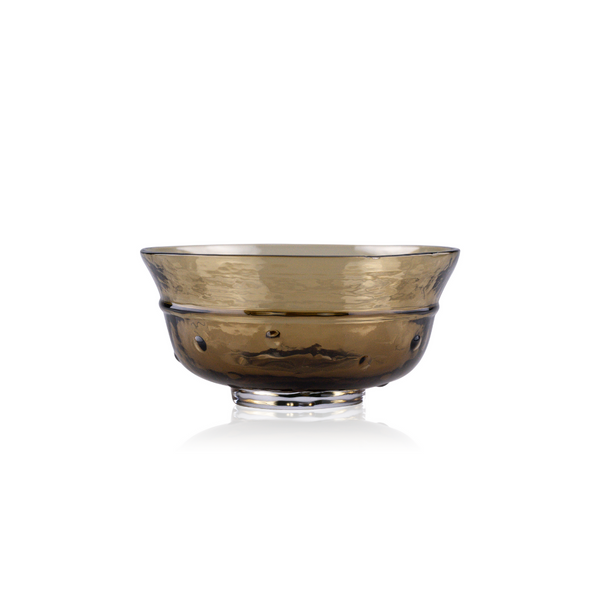  deep amber-colored glass bowl with a wide brim and a sturdy base. The bowl's glass has a reflective quality with a textured surface that captures light, creating a sense of depth and warmth. It is displayed against a pure white background for a stark and elegant contrast