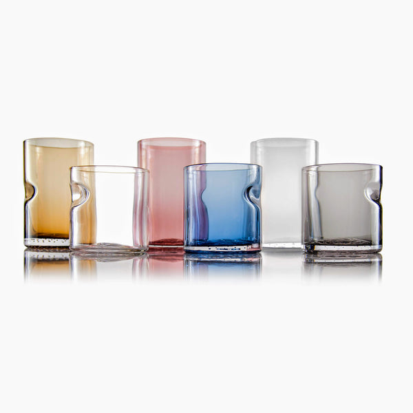 Assorted Tundra Series Drinking Glasses by Dougherty Glassworks, showcasing a variety of colors including Lichen Green and Dusty Rose.
