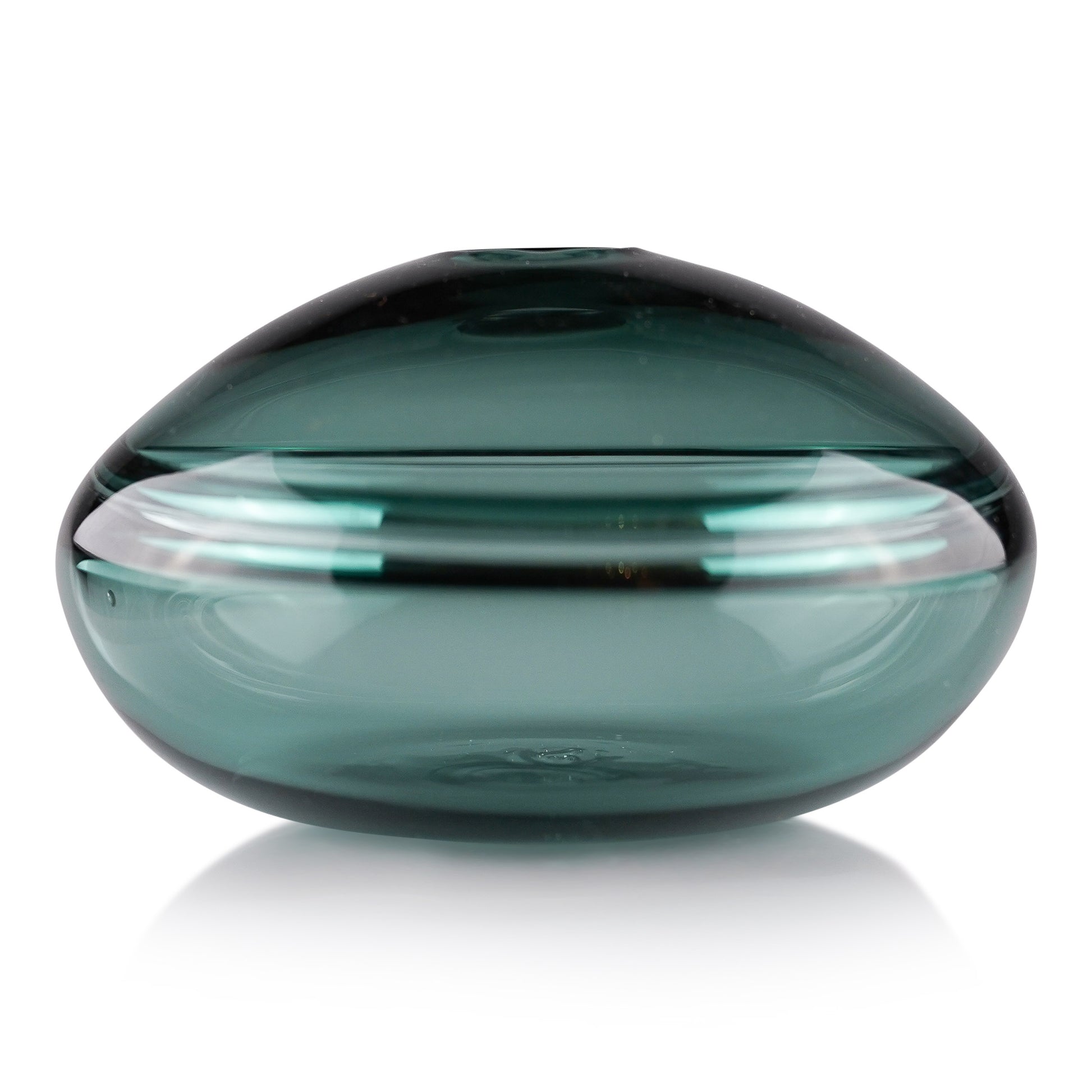 A squat glass vessel with a wide, flattened body and a narrow, raised lid, photographed against a white background, showcasing its smooth lines and tranquil, translucent color, reflective of serene, contemporary glass artistry.