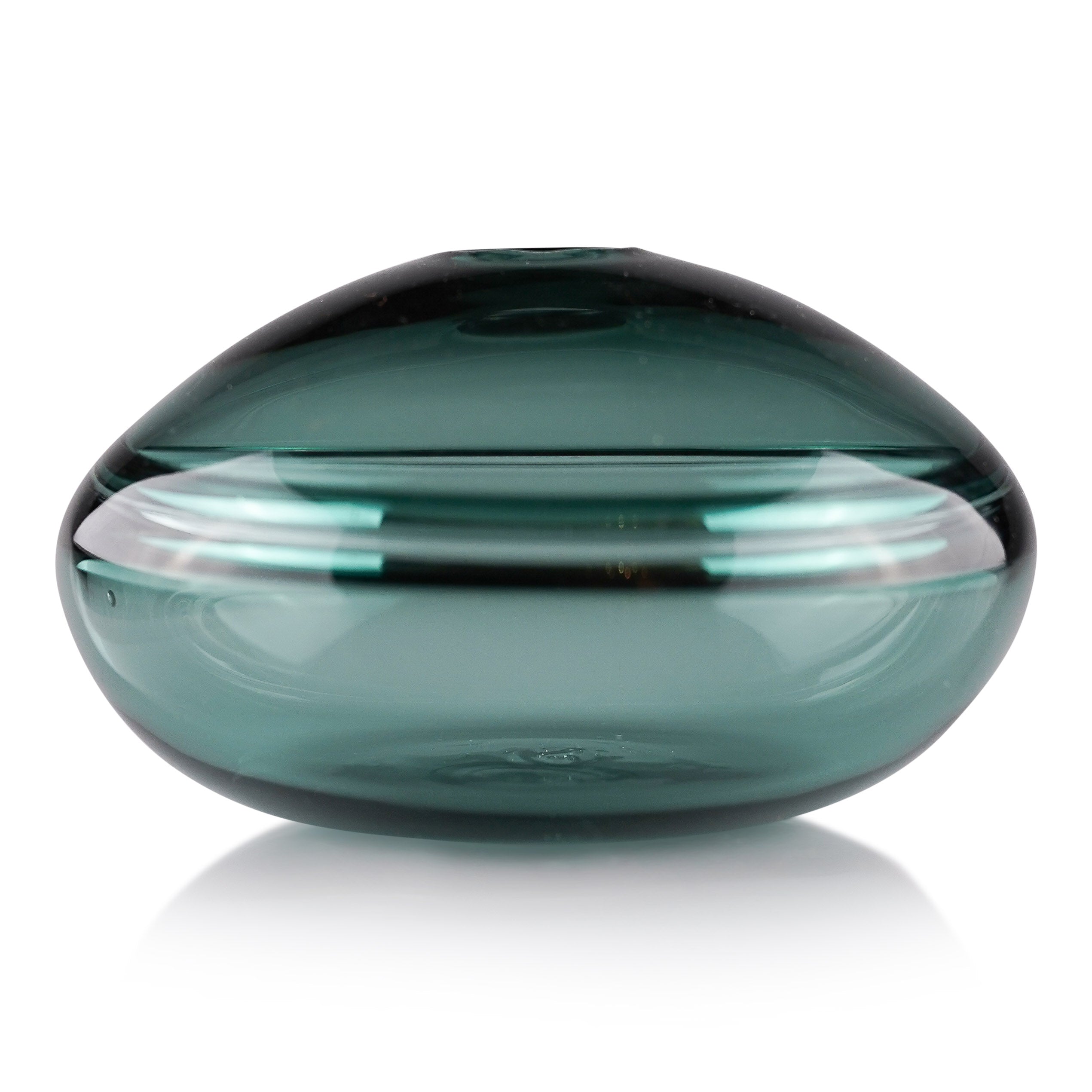 A squat glass vessel with a wide, flattened body and a narrow, raised lid, photographed against a white background, showcasing its smooth lines and tranquil, translucent color, reflective of serene, contemporary glass artistry.