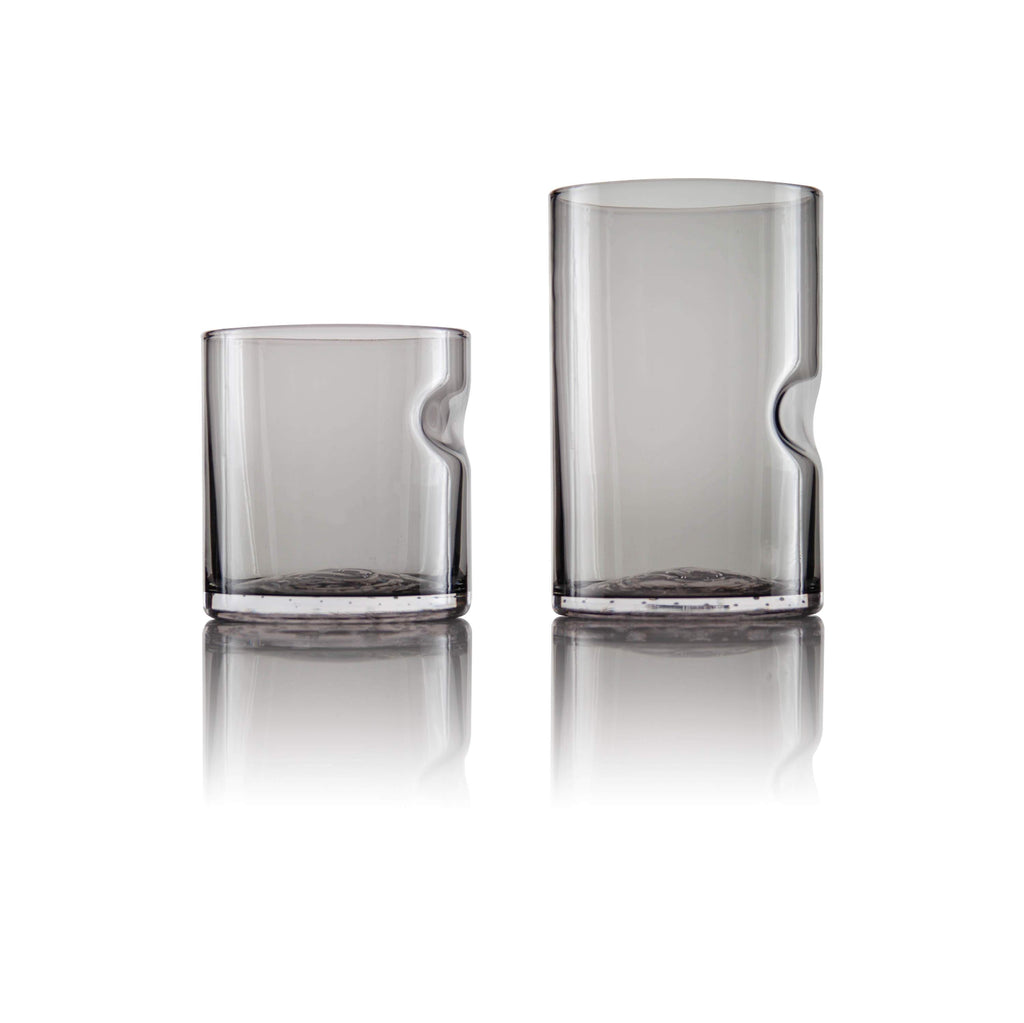Close-up view of Tundra Series Drinking Glass in Smoke Grey with ergonomic thumb divot detail.