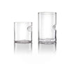 glass tumblers with an inventive thumb groove design; one short and the other tall, displayed side by side on a reflective surface, merging utility with a touch of elegance.