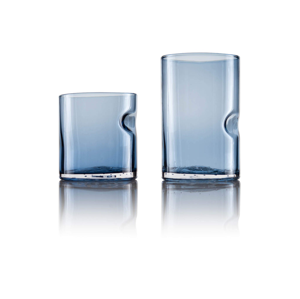 Close-up view of Tundra Series Drinking Glass in Glacial Blue with ergonomic thumb divot detail.