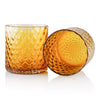 Close-up of the Deco Collection amber glass, highlighting the intricate craftsmanship and smooth finish.