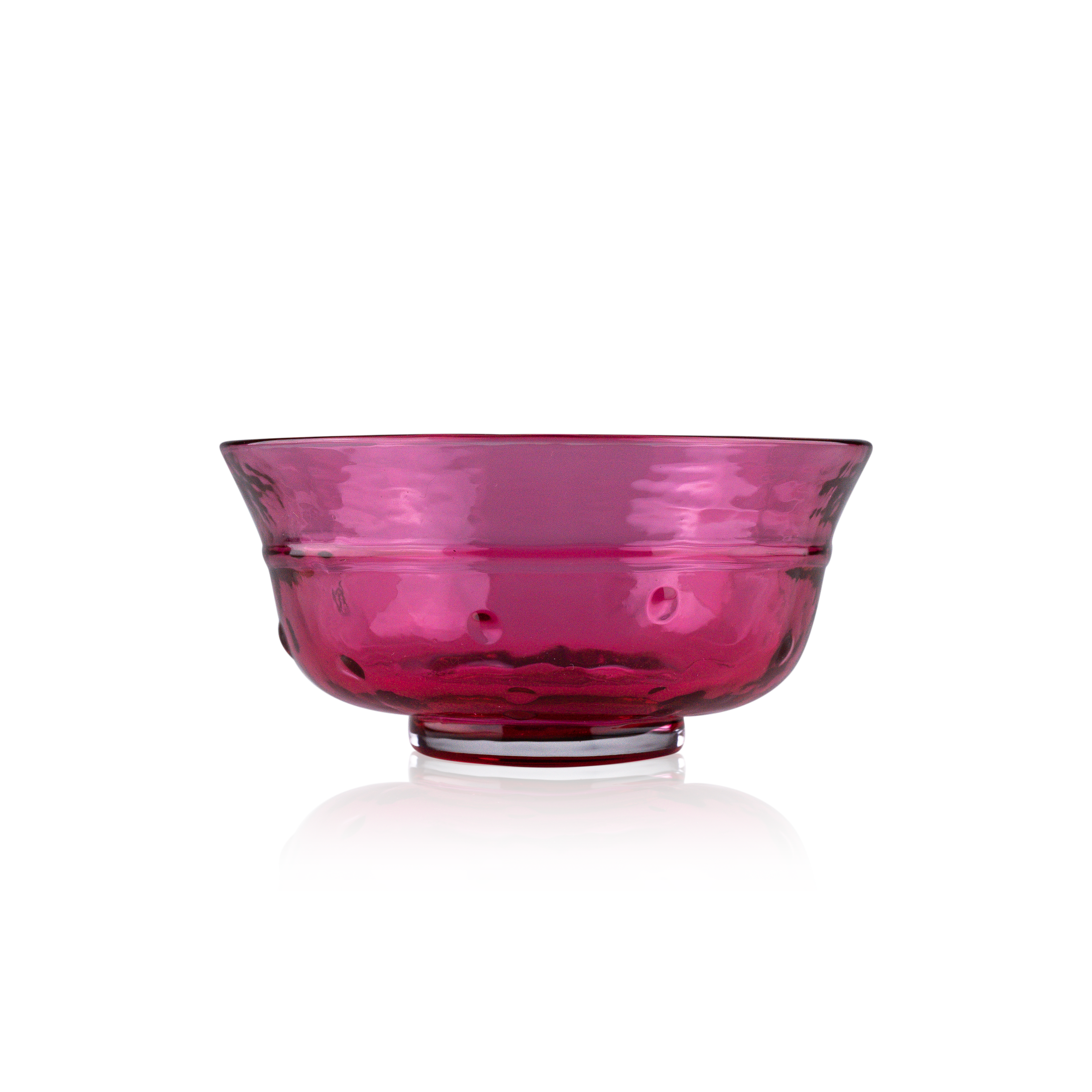 A classic deep glass bowl with a textured exterior and smooth rim, sitting on a clear base. The bowl's rich color and subtle design elements are highlighted against a pure white background, exemplifying timeless glass craftsmanship.