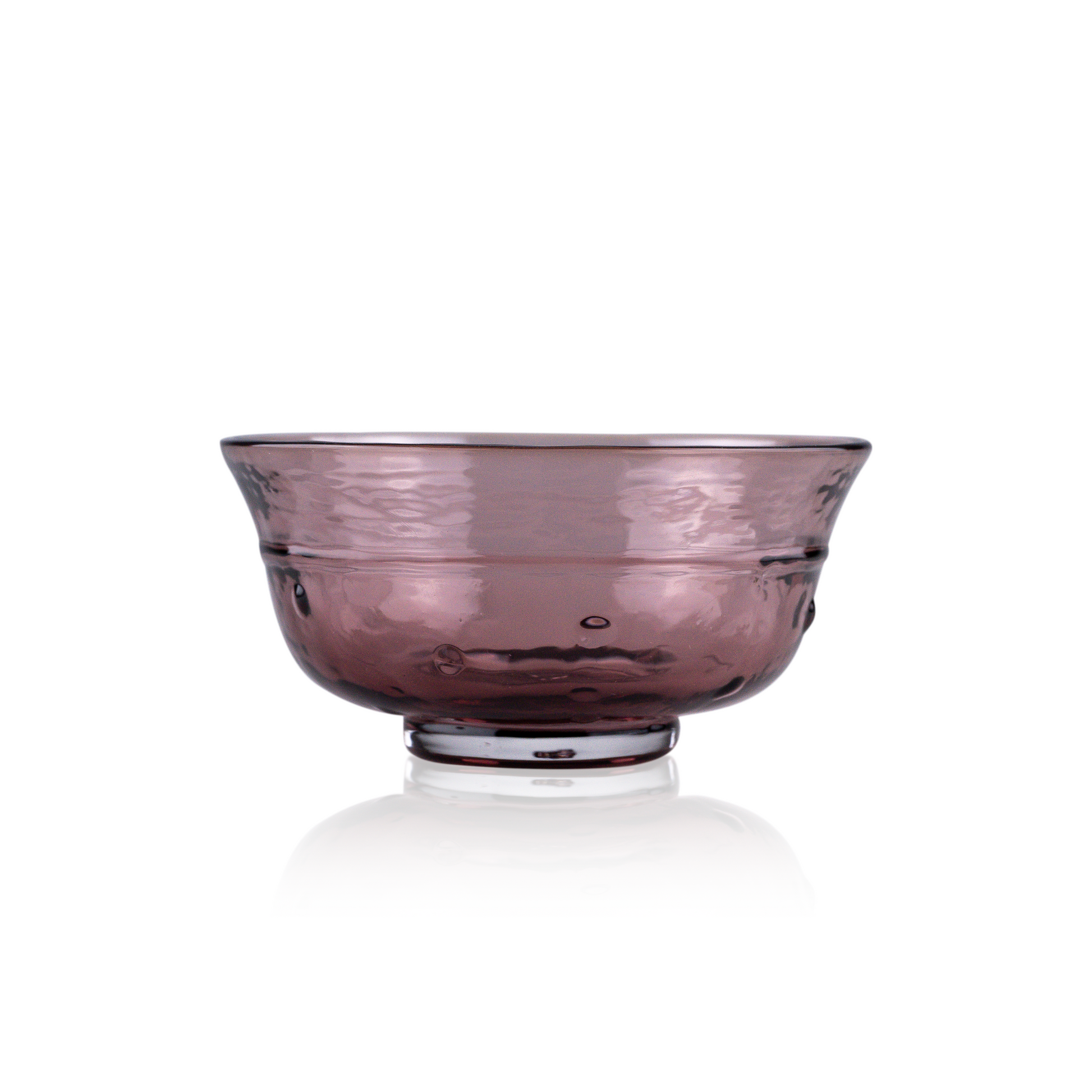A classic deep glass bowl with a textured exterior and smooth rim, sitting on a clear base. The bowl's rich color and subtle design elements are highlighted against a pure white background, exemplifying timeless glass craftsmanship.