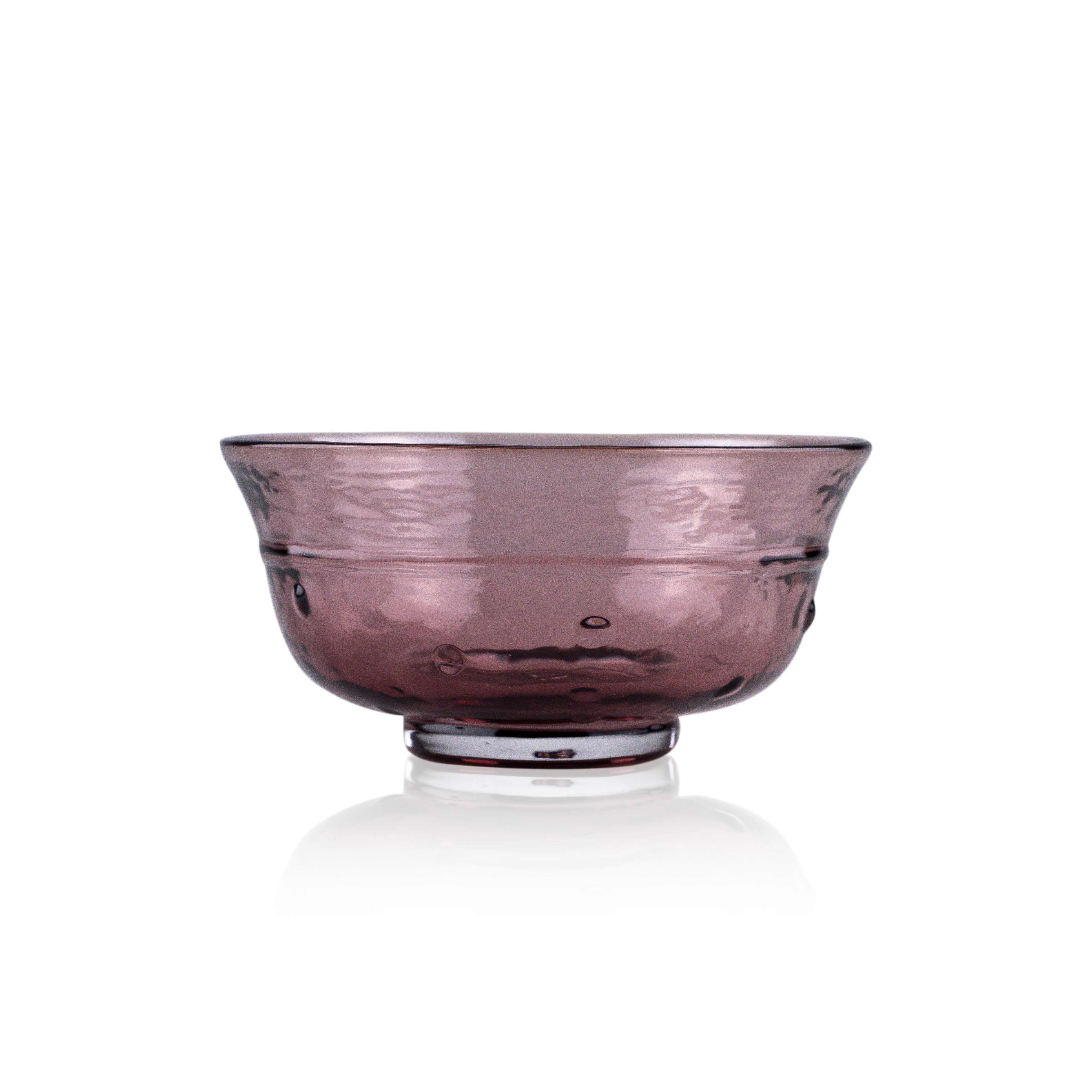 A classic deep glass bowl with a textured exterior and smooth rim, sitting on a clear base. The bowl's rich color and subtle design elements are highlighted against a pure white background, exemplifying timeless glass craftsmanship.