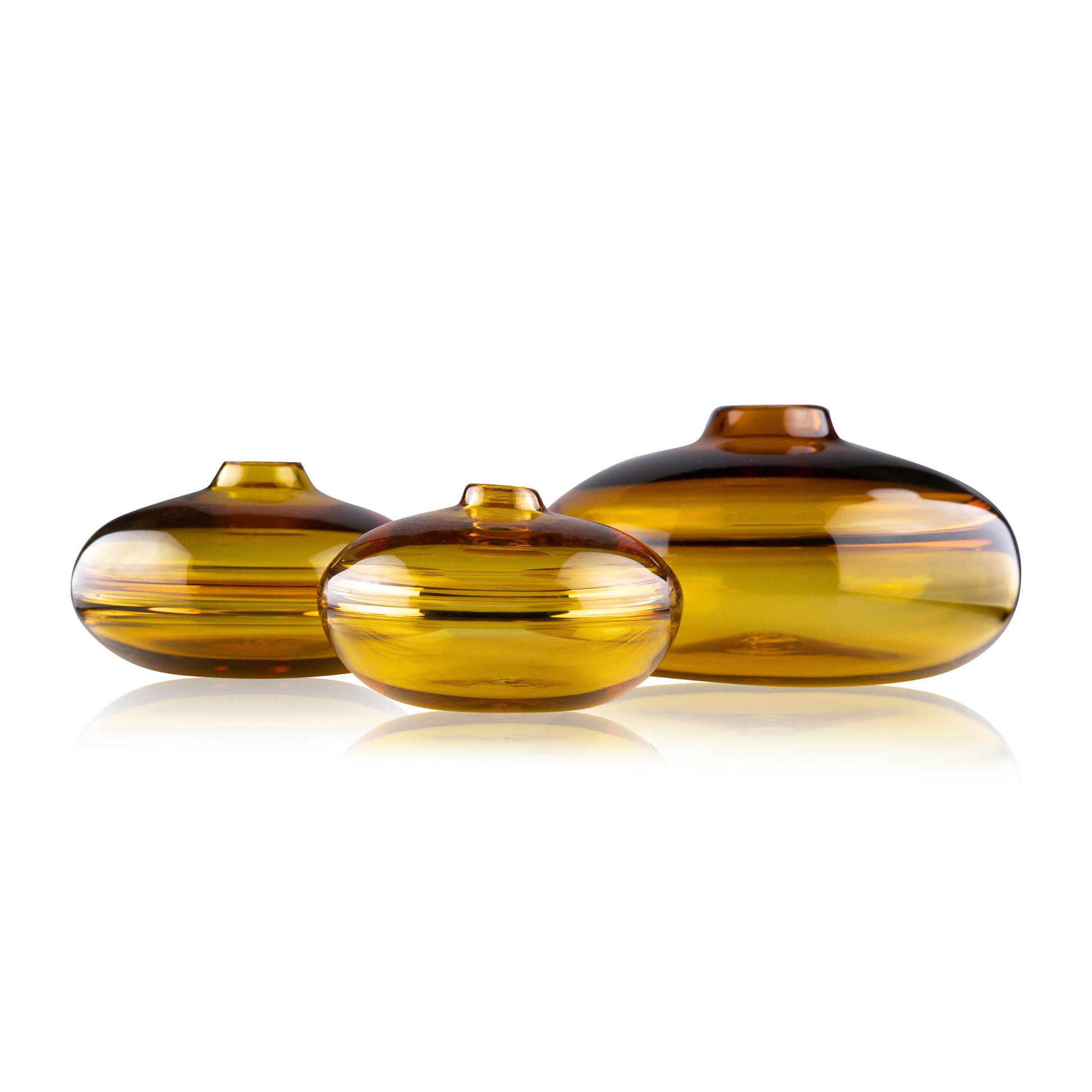 A squat glass vessel with a wide, flattened body and a narrow, raised lid, photographed against a white background, showcasing its smooth lines and tranquil, translucent color, reflective of serene, contemporary glass artistry.