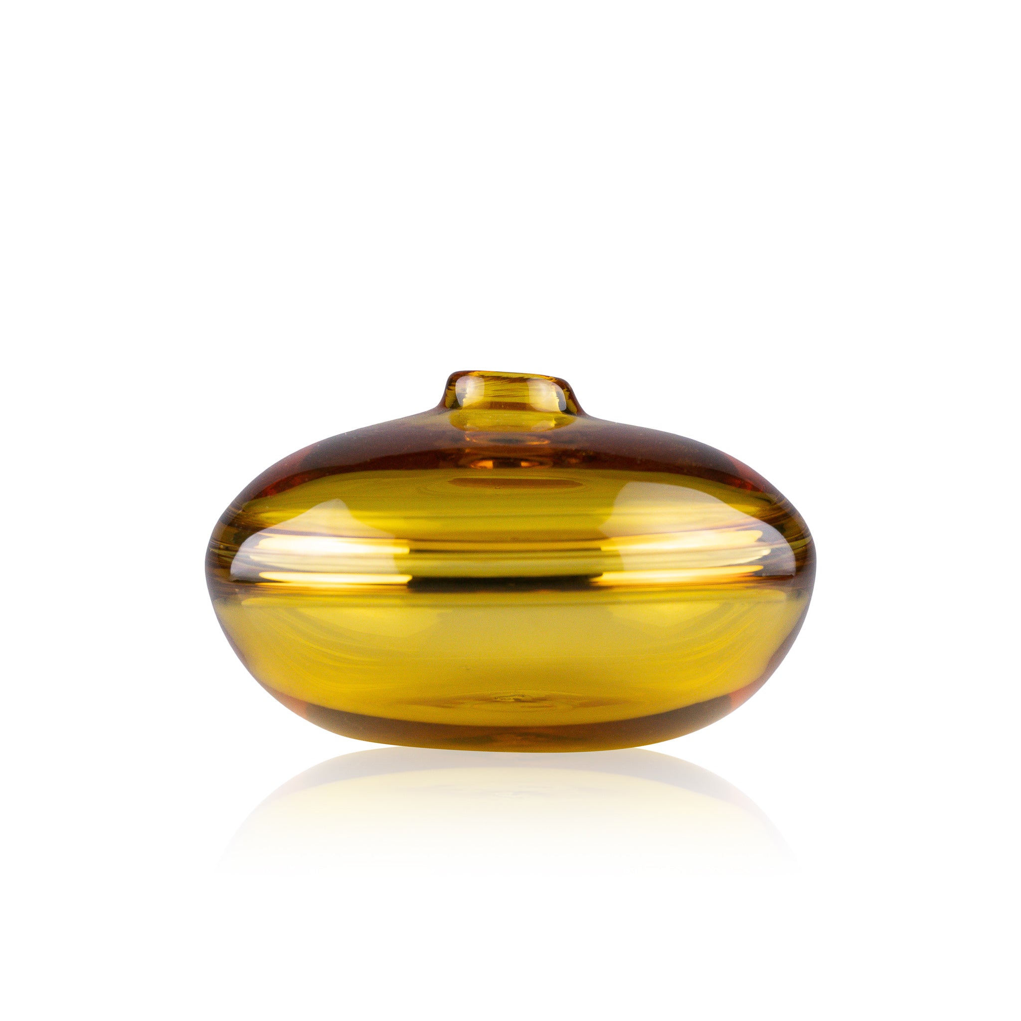 A squat glass vessel with a wide, flattened body and a narrow, raised lid, photographed against a white background, showcasing its smooth lines and tranquil, translucent color, reflective of serene, contemporary glass artistry.