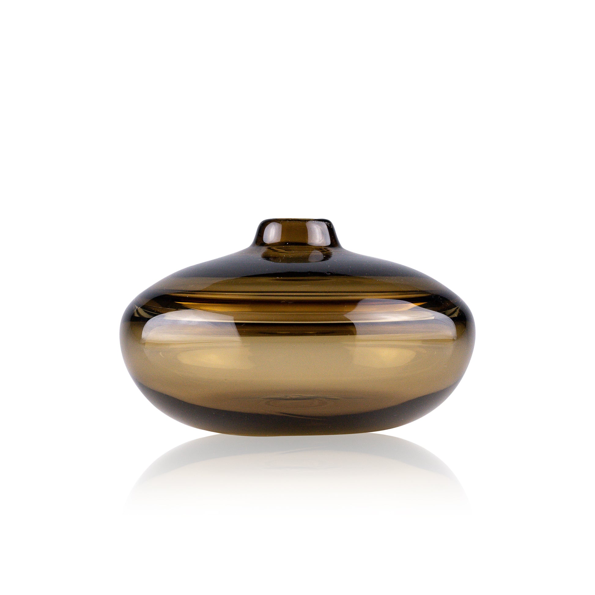 A squat glass vessel with a wide, flattened body and a narrow, raised lid, photographed against a white background, showcasing its smooth lines and tranquil, translucent color, reflective of serene, contemporary glass artistry.