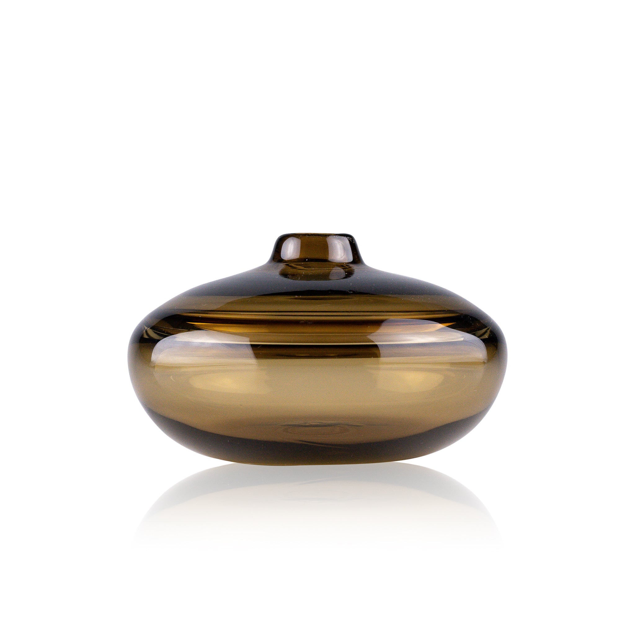A squat glass vessel with a wide, flattened body and a narrow, raised lid, photographed against a white background, showcasing its smooth lines and tranquil, translucent color, reflective of serene, contemporary glass artistry.