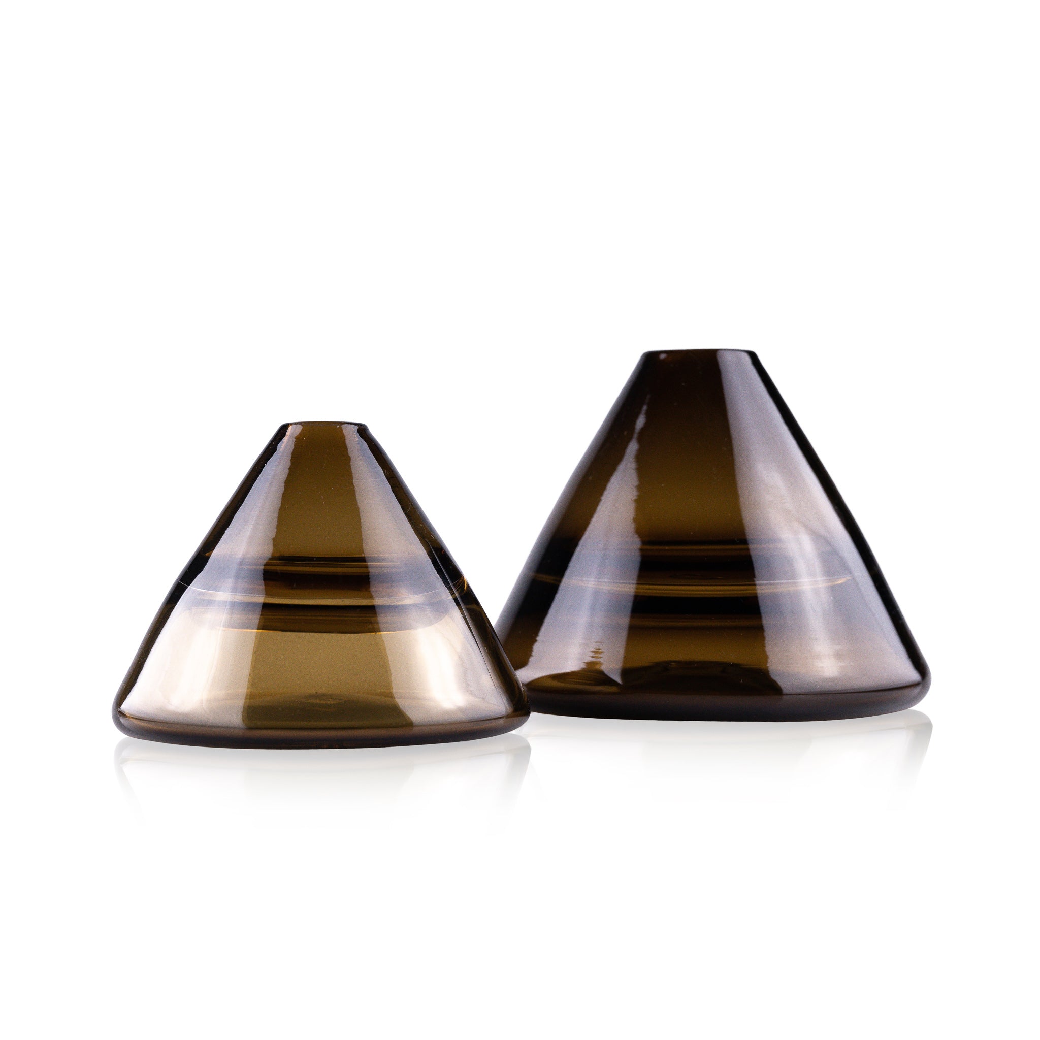 Unconventional halo vase with a conical shape, arranged in a staggered formation and reflected on a glossy surface, highlighting their sleek and contemporary design.